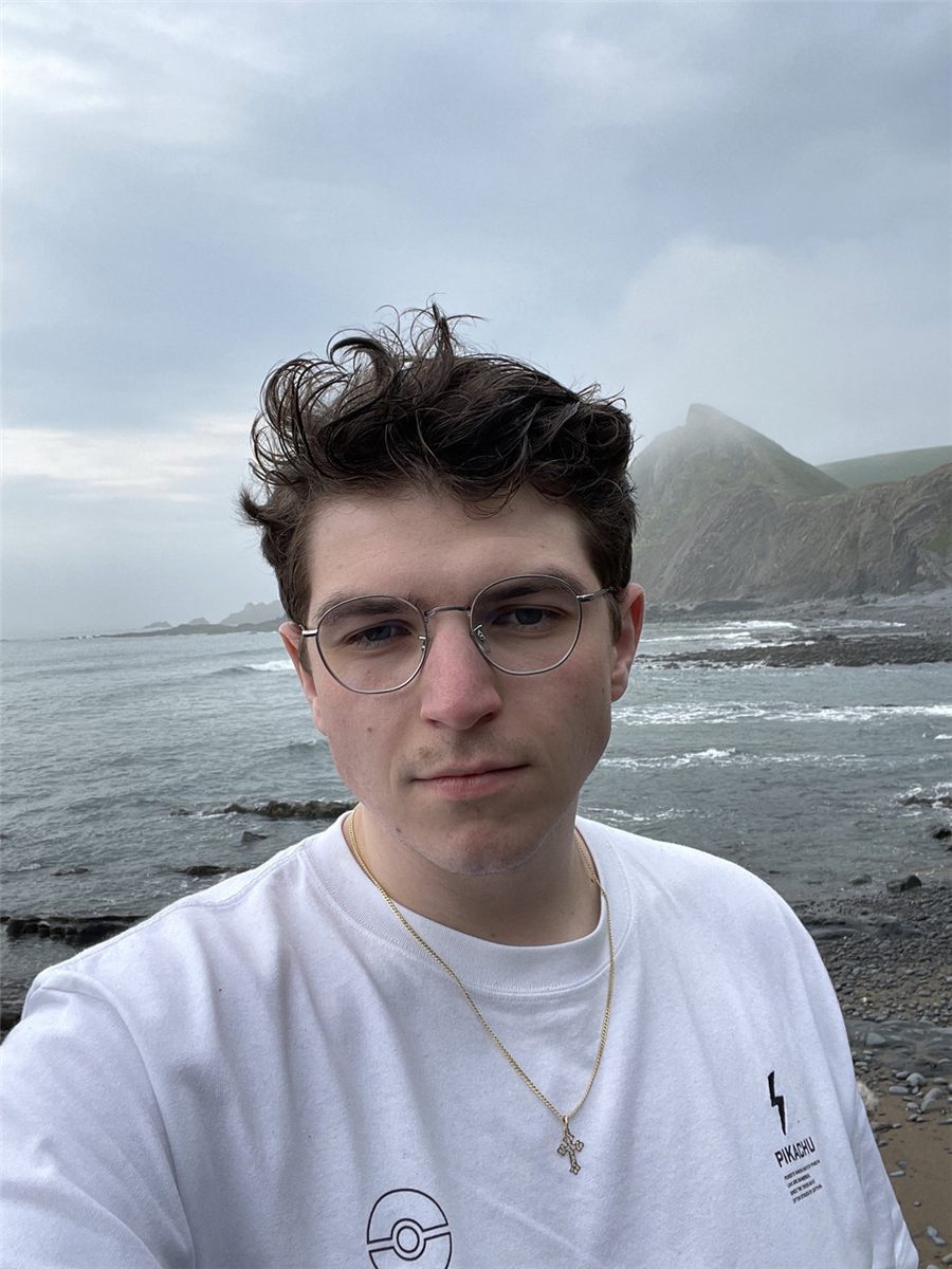 Filip Neumann on a rocky beach